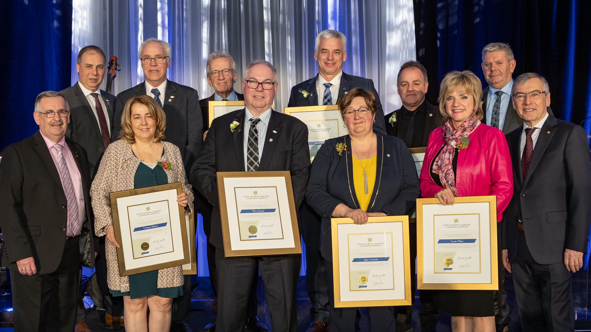 La Coop fédérée's President, Ghislain Gervais, alongside des winners of l'Ordre du Mérite